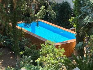 Bazén v ubytování LE TRE M - Guesthouse nebo v jeho okolí