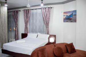 Postel nebo postele na pokoji v ubytování Upmax Cosy Home