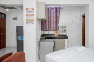 Kuchyň nebo kuchyňský kout v ubytování Upmax Cosy Home