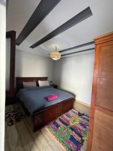 Ένα ή περισσότερα κρεβάτια σε δωμάτιο στο Cozy Apartment Tamraght +7 φωτογραφίες