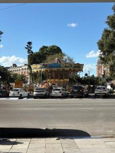 a street with cars parked on the side of a road at Departamento frente al casino in Mar del Plata