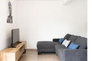 Posezení v ubytování Appartement des 5 Trésors - piscine et vue panoramique