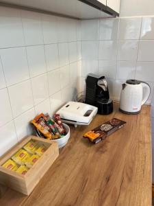 a kitchen counter with food and a toaster at Nostalgia apartments in Jajce