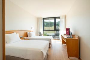 A bed or beds in a room at Exe Area Central