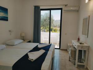 Postel nebo postele na pokoji v ubytování Hotel Narkissos + 37 fotografií