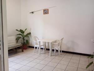 a white table and chairs in a room at Luna y Mar in Oaxaca City +24 photos