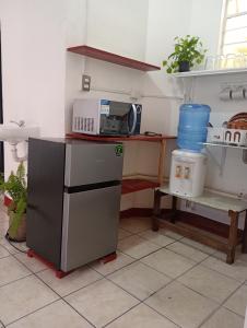 a kitchen with a counter with a microwave at Luna y Mar in Oaxaca City