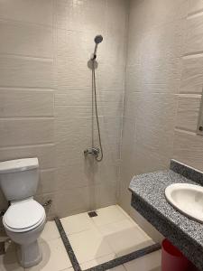 a bathroom with a toilet and a sink at Dream Chalet In Mirage Bay Resort in Hurghada