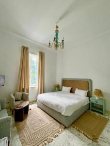 Postel nebo postele na pokoji v ubytování La Maison Tanit