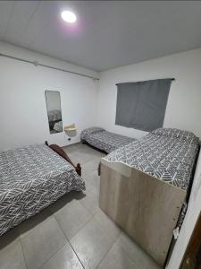 Ένα ή περισσότερα κρεβάτια σε δωμάτιο στο Los abuelos