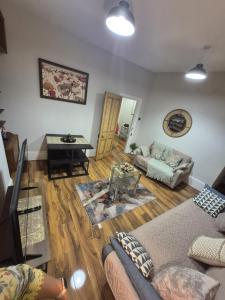 a living room with a couch and a table at Spacious Apartment in London in London