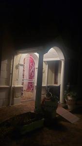 a house with a red door in a dark room at The Wellstead in Cape Town +5 photos