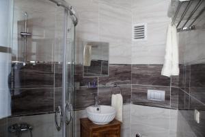 a bathroom with a sink and a shower at Lal Hotel Bursa in Bursa +31 photos