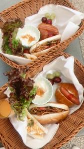two baskets of food with hot dogs and vegetables at ガーデンリゾート 潮美庵 in Hatsukaichi +54 photos