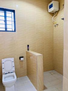 a bathroom with a toilet and a shower stall at One bedroom Dodoma in Dodoma +32 photos