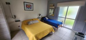 Postel nebo postele na pokoji v ubytování Departamento cerca del centro Andes Maristas