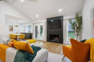 a living room with a couch and a fireplace at Stylish Austin Escape 4BR, 2BA, Minutes from Domain, Q2 Stadium in Austin