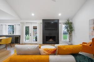 a living room with a couch and a fireplace at Stylish Austin Escape 4BR, 2BA, Minutes from Domain, Q2 Stadium in Austin