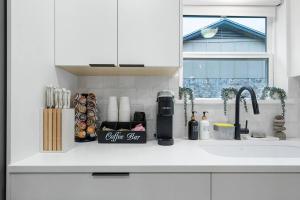 a kitchen counter with a coffee bar on it at Stylish Austin Escape 4BR, 2BA, Minutes from Domain, Q2 Stadium in Austin