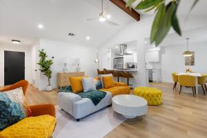 a living room with a couch and a table at Stylish Austin Escape 4BR, 2BA, Minutes from Domain, Q2 Stadium in Austin