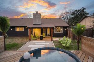 a house with a backyard with a swimming pool at Stylish Austin Escape 4BR, 2BA, Minutes from Domain, Q2 Stadium in Austin