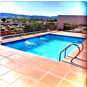 a swimming pool on top of a building at Apartamento Vista Buena in Talca