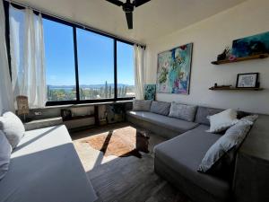 a living room with a couch and large windows at Casa Mantra Ocean View & Private Terrace in La Ventana +5 photos