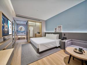 Ліжко або ліжка в номері Country Inn&Suites By Radisson, Xi'an Bell and Drum Tower Flagship
