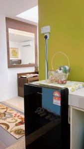 a kitchen with a counter with a basket on top of it at Wan Studiostay by Khalifa Suites in Kota Bharu