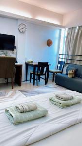 a bedroom with a bed with two pillows on it at Wan Studiostay by Khalifa Suites in Kota Bharu +4 photos