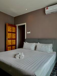 Postel nebo postele na pokoji v ubytování Stirling Suites Hotel & Serviced Apartment
