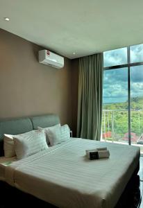 Postel nebo postele na pokoji v ubytování Stirling Suites Hotel & Serviced Apartment