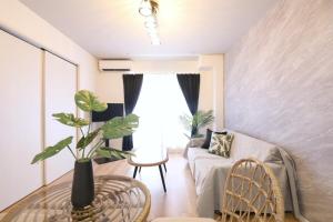 Postel nebo postele na pokoji v ubytování フォルモント寺田町 202