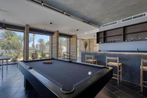 a billiard room with a pool table at OR Cabo Boutique Residences by Lumina in Cabo San Lucas +11 photos