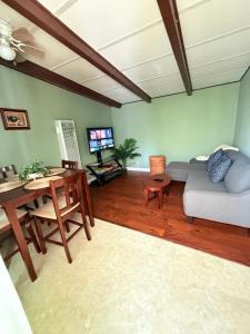 a living room with a couch and a table at Centrally located adu in Eureka