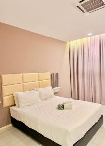 Postel nebo postele na pokoji v ubytování Stirling Suites Hotel & Serviced Apartment