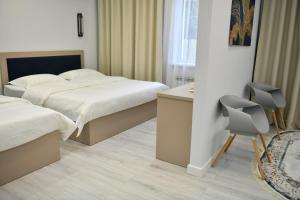 Postel nebo postele na pokoji v ubytování QUT Hotel