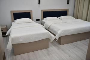 Postel nebo postele na pokoji v ubytování QUT Hotel
