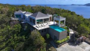 an aerial view of a house with a swimming pool at Window to the Sea - Phenomenal Pool and Hot Tub Villa in East End