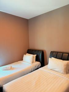 Postel nebo postele na pokoji v ubytování Stirling Suites Hotel & Serviced Apartment