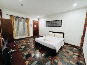 Postel nebo postele na pokoji v ubytování New Panjang Jiwo Resort Syariah
