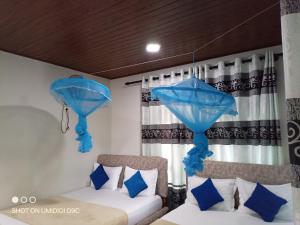 Postel nebo postele na pokoji v ubytování Summer villa Ambagolla
