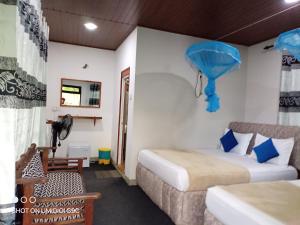 Postel nebo postele na pokoji v ubytování Summer villa Ambagolla
