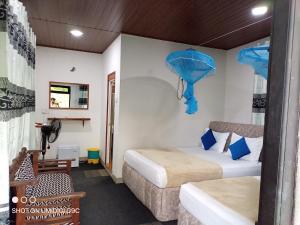 Postel nebo postele na pokoji v ubytování Summer villa Ambagolla