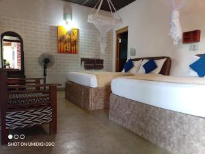 Postel nebo postele na pokoji v ubytování Summer villa Ambagolla