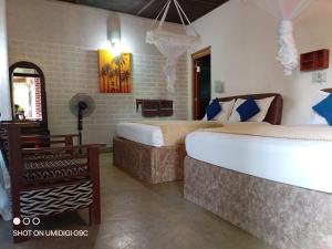 Postel nebo postele na pokoji v ubytování Summer villa Ambagolla