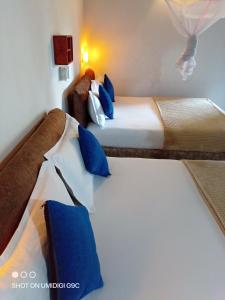 Postel nebo postele na pokoji v ubytování Summer villa Ambagolla