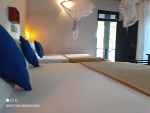 Postel nebo postele na pokoji v ubytování Summer villa Ambagolla