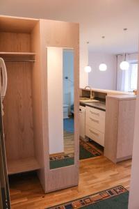 a room with a large mirror in a kitchen at Metsa 49 Apartment in Haapsalu