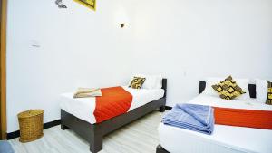Voodi või voodid majutusasutuse SMW Lodge Sigiriya toas
